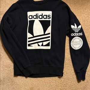 Adidas Black and White sweatshirt. This material is perfect for the winter.